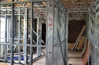 Interior corridor with steel stud framing and trusses