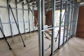 Metal framing installed for interior walls in a building under construction.