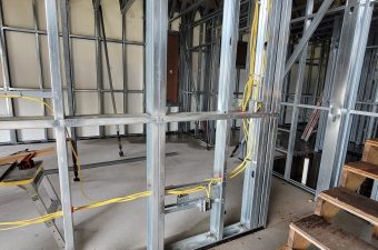 Exposed metal studs and wiring in a building under construction or renovation.