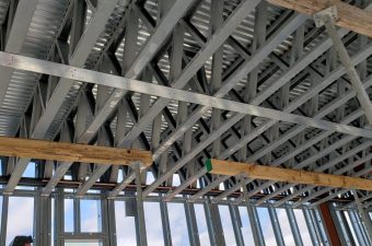 Interior steel roof trusses and temporary supports