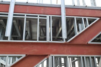 Steel framing structure under construction on a building.