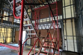 Scaffolding set up inside a building for construction or maintenance work.