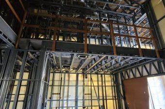 Steel framework and scaffolding inside a building under construction.