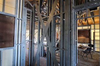 Metal framing and cross braces in building under construction.