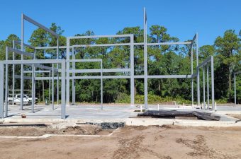 Open steel frame with forest backdrop