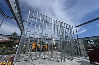 Steel building frame under blue sky