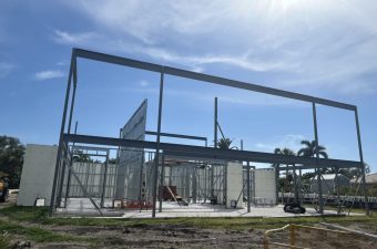 Steel frame building under clear blue sky