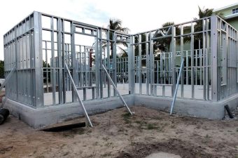 Steel frame structure under construction on a building site.