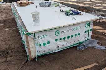 Large industrial machine with control panel outdoors.